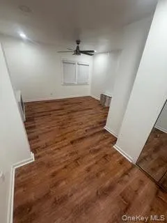 an empty room with wooden floor