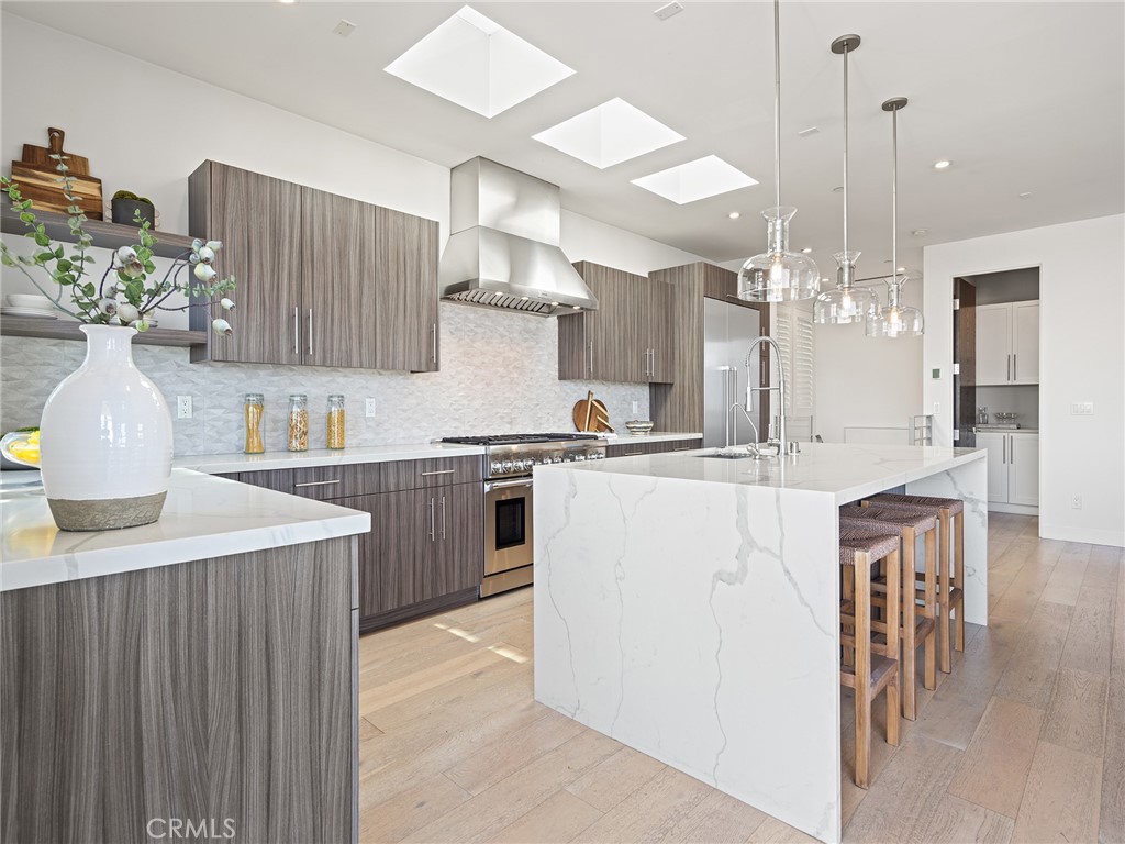 320 35th Street Manhattan Beach, CA 90266 - Photo 11 of 29 a kitchen with kitchen island a sink counter top space and appliances