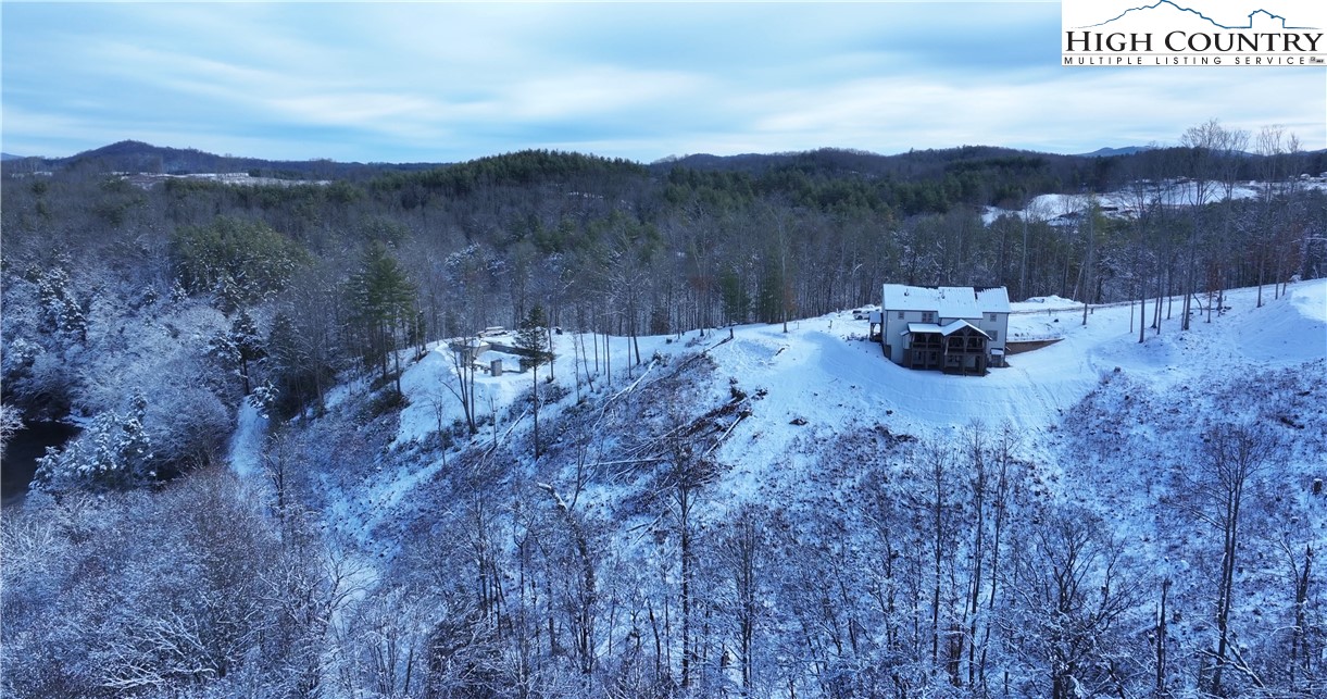 56 Autumn Leaf Way Crumpler, NC 28617 - Photo 30 of 44 a view of a backyard with table and chairs and wooden fence