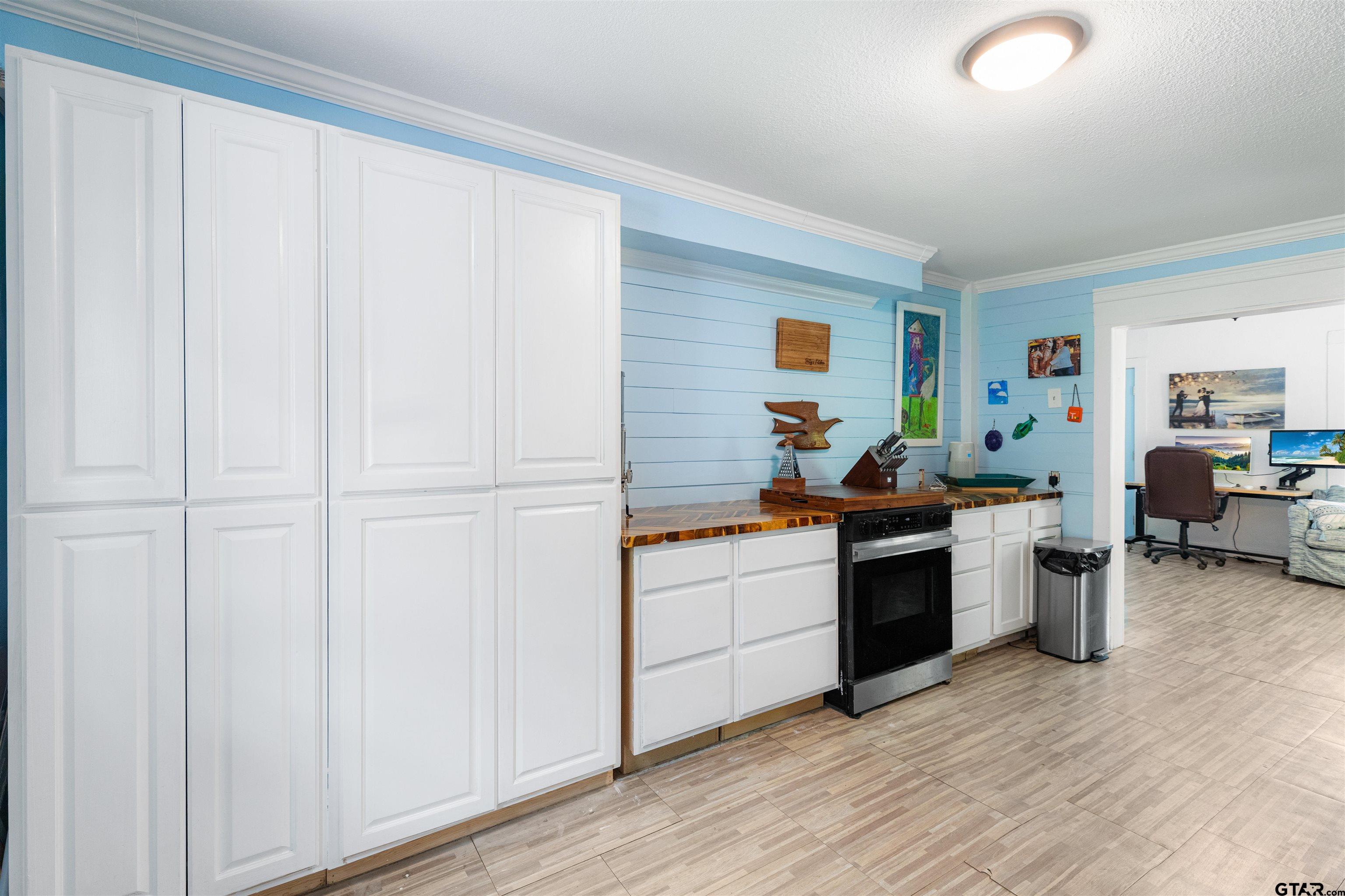408 Morton Palacios, TX 77465 - Photo 13 of 29 a kitchen with stainless steel appliances granite countertop a sink stove and cabinets