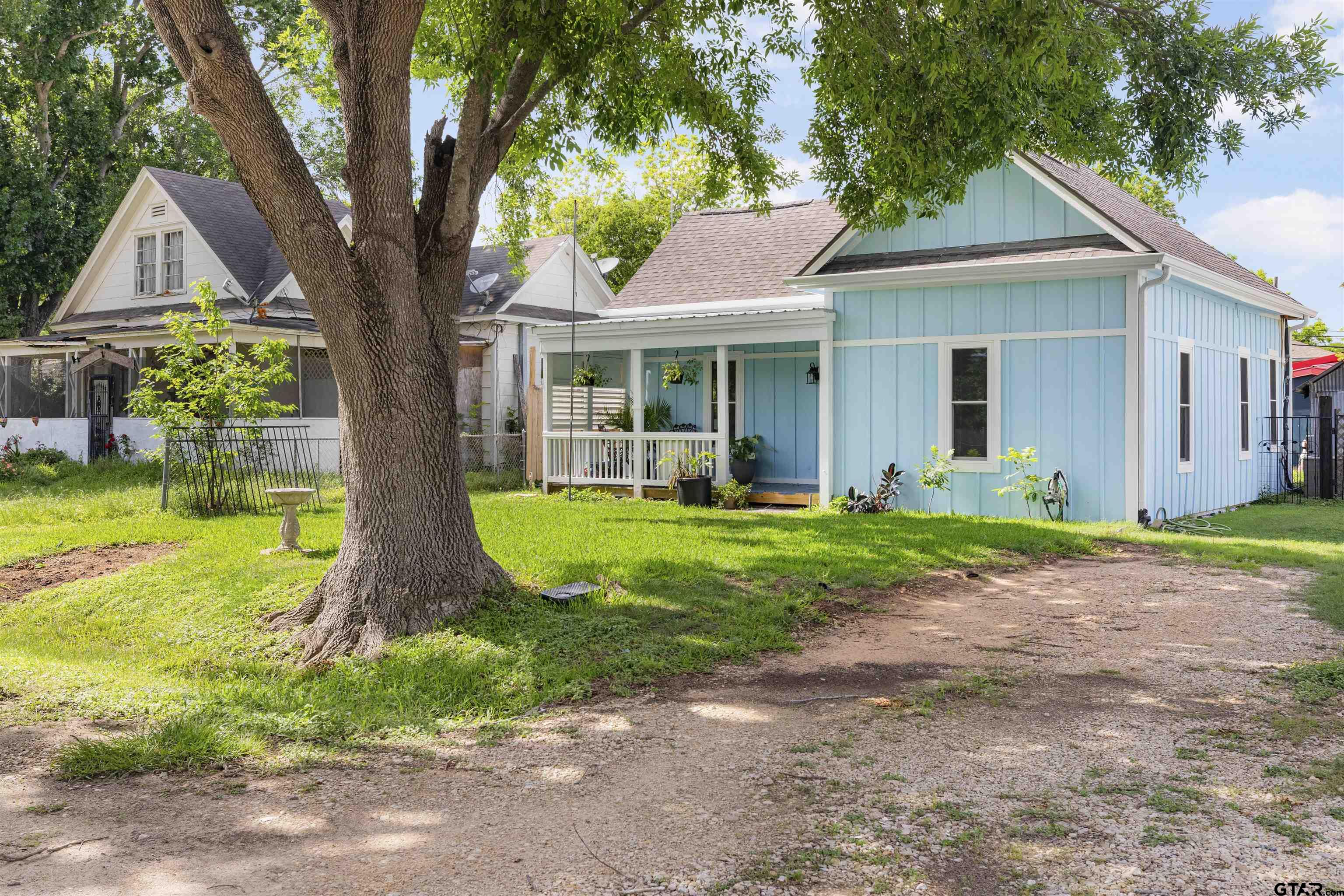 408 Morton Palacios, TX 77465 - Photo 2 of 29 a front view of a house with garden