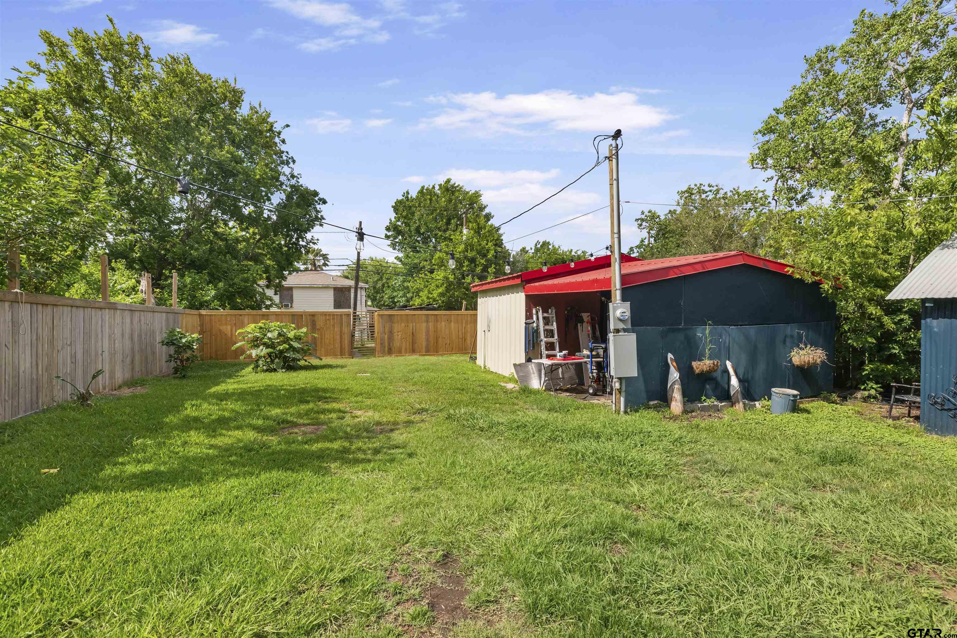 408 Morton Palacios, TX 77465 - Photo 21 of 29 a view of a house with a yard and sitting area