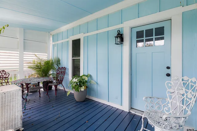 a view of a livingroom with furniture and hardwood floor
