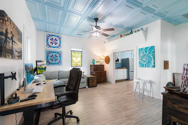 a workspace with furniture and wooden floor