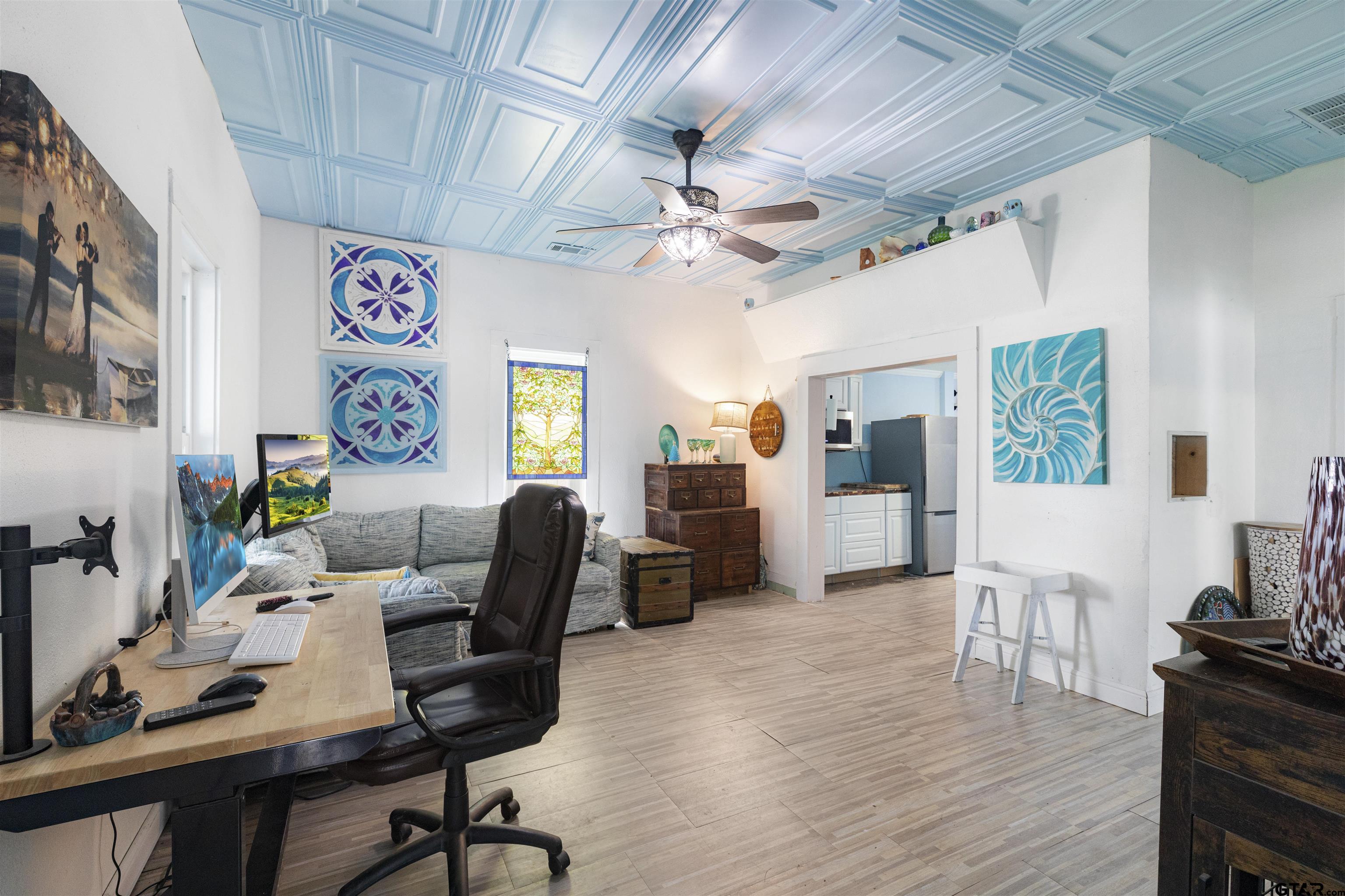 408 Morton Palacios, TX 77465 - Photo 5 of 29 a workspace with furniture and wooden floor