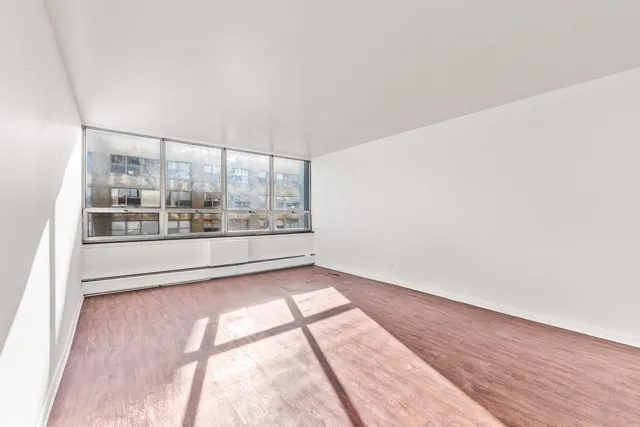 a kitchen with granite countertop a sink stove and refrigerator