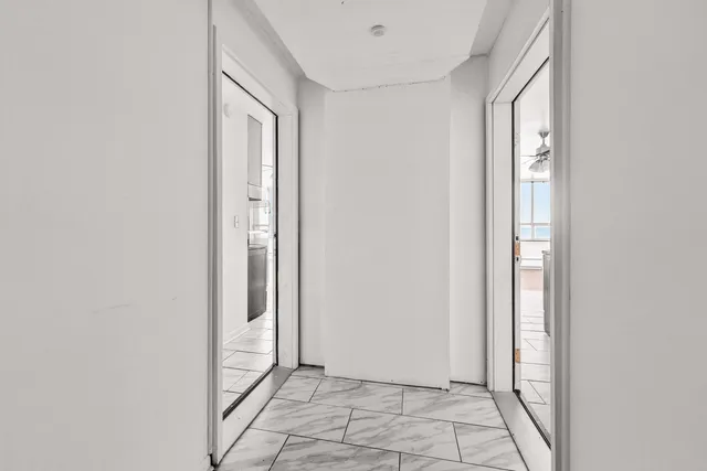 a kitchen with stainless steel appliances a refrigerator and a stove