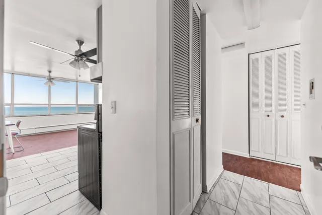 a kitchen with granite countertop a refrigerator sink and stove