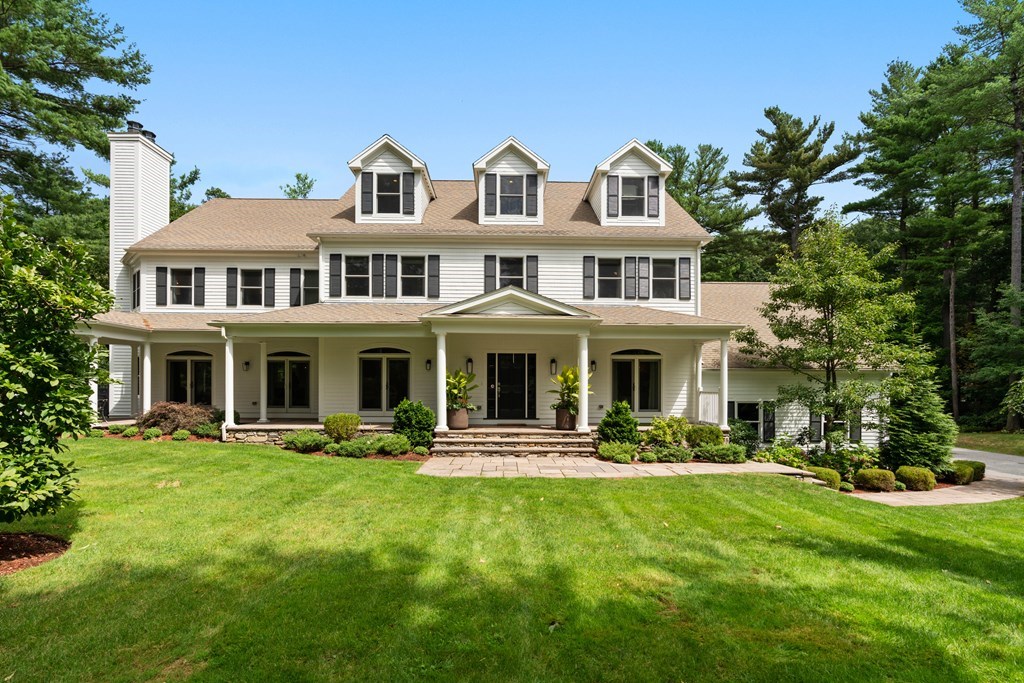 25 Westcliff Road Weston, MA 02493 - Photo 1 of 19 a front view of a house with a yard table and chairs