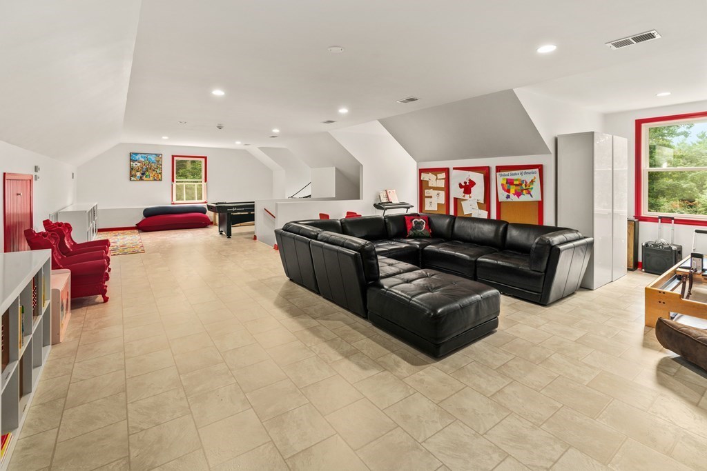 25 Westcliff Road Weston, MA 02493 - Photo 16 of 19 a living room with furniture and a flat screen tv