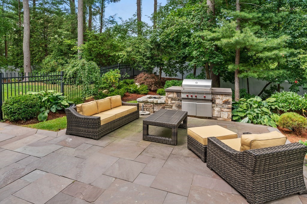 25 Westcliff Road Weston, MA 02493 - Photo 17 of 19 a view of a patio with couches and a fire pit
