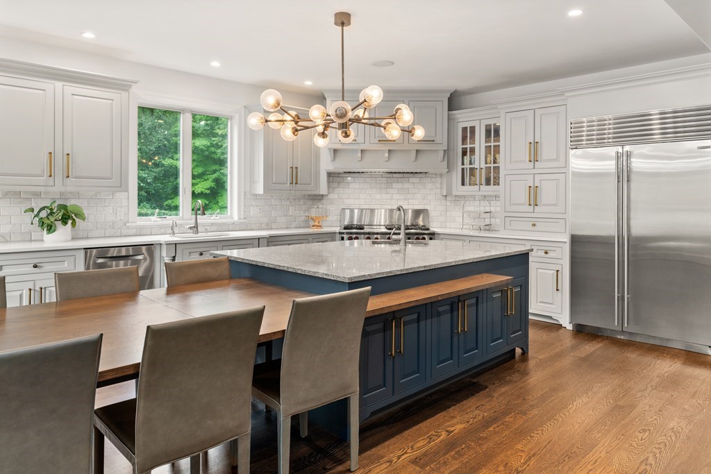 25 Westcliff Road Weston, MA 02493 - Photo 9 of 19 a kitchen with stainless steel appliances granite countertop a sink stove and refrigerator