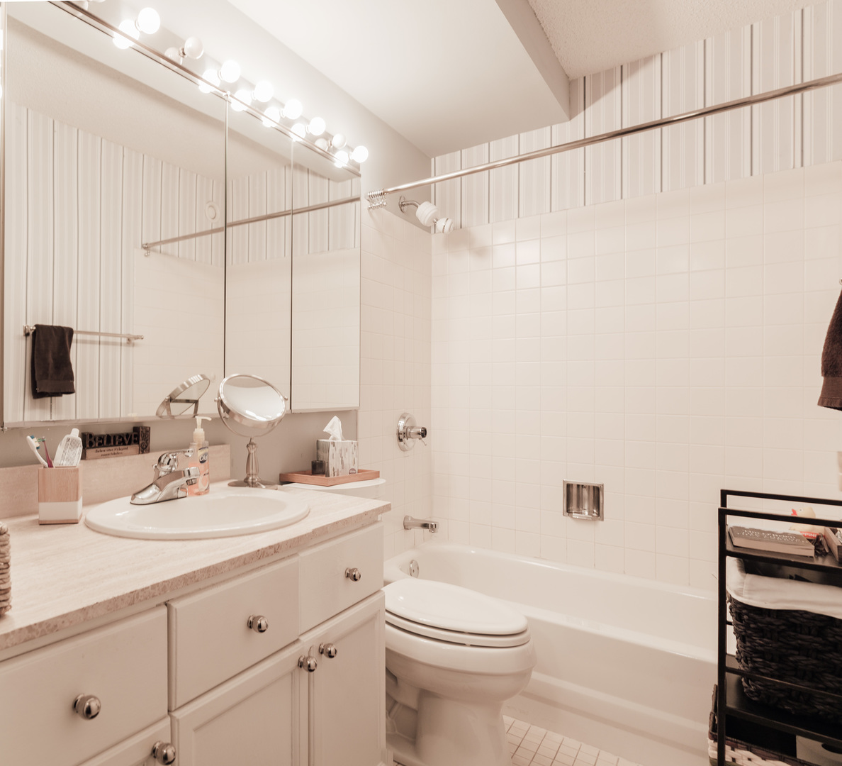 195 North Harbor Drive, Unit 905 Chicago, IL 60601 - Photo 8 of 19 a bathroom with a double vanity sink toilet and shower