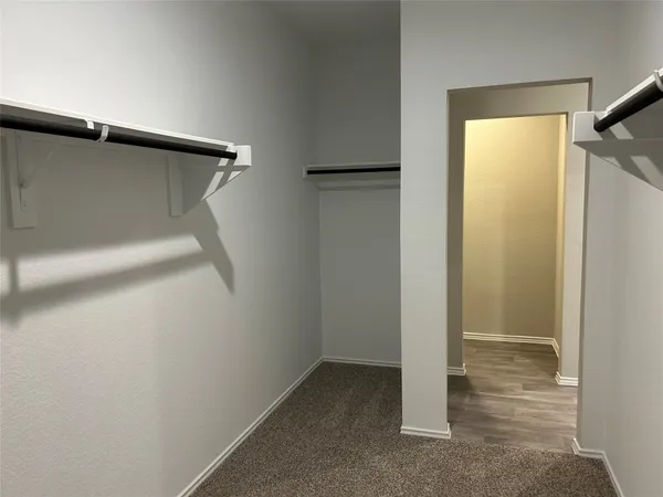 a view of an empty walk in closet