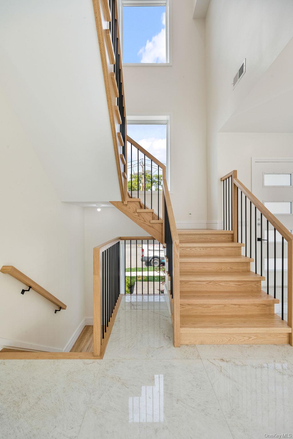 20 Singer Avenue, Unit 202 Spring Valley, NY 10977 - Photo 19 of 50 a view of staircase with railing and white walls