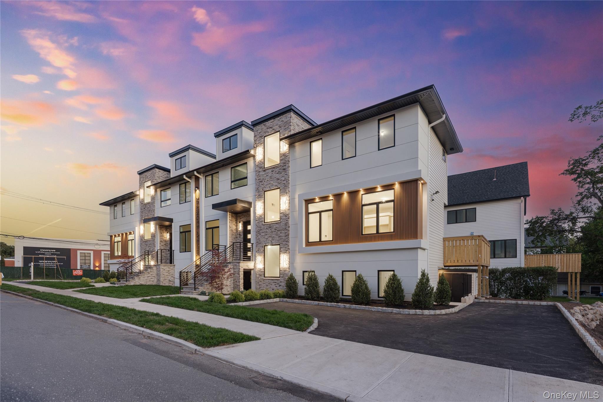 20 Singer Avenue, Unit 202 Spring Valley, NY 10977 - Photo 2 of 50 a front view of a house with a yard