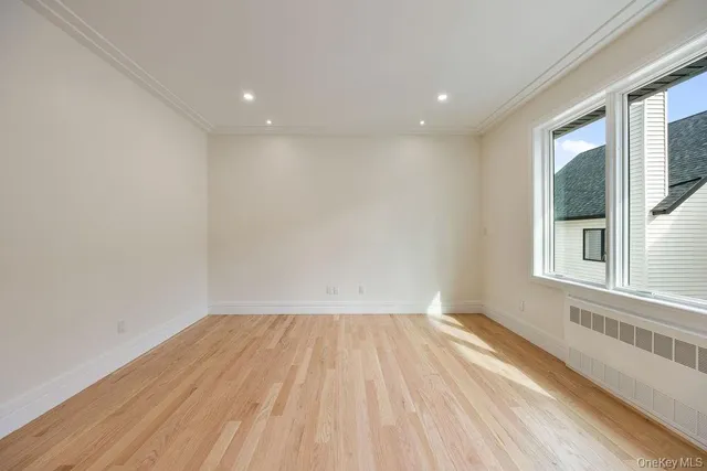 a bathroom with a sink a toilet a mirror and shower