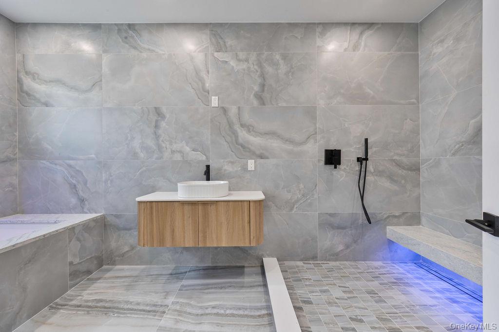 20 Singer Avenue, Unit 202 Spring Valley, NY 10977 - Photo 23 of 50 a bathroom with a sink and a mirror