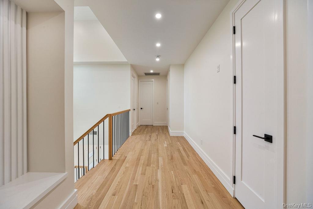 20 Singer Avenue, Unit 202 Spring Valley, NY 10977 - Photo 28 of 50 a view of a hallway with wooden floor