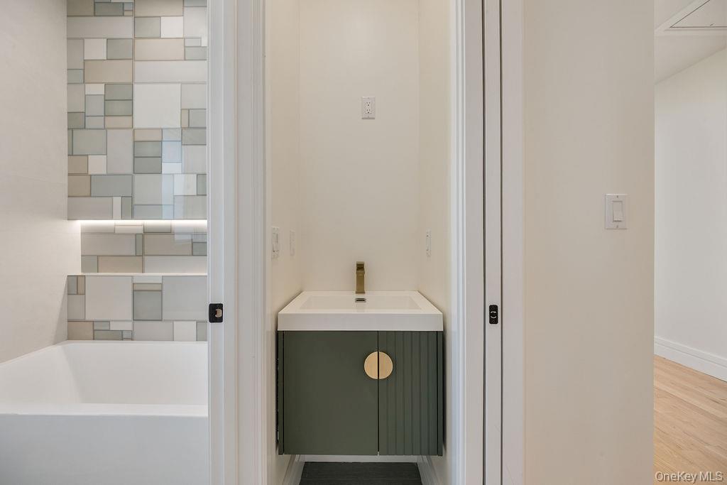 20 Singer Avenue, Unit 202 Spring Valley, NY 10977 - Photo 30 of 50 a bathroom with a sink and a bathtub