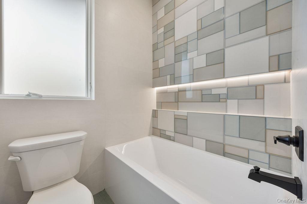 20 Singer Avenue, Unit 202 Spring Valley, NY 10977 - Photo 31 of 50 a bathroom with a toilet and a sink