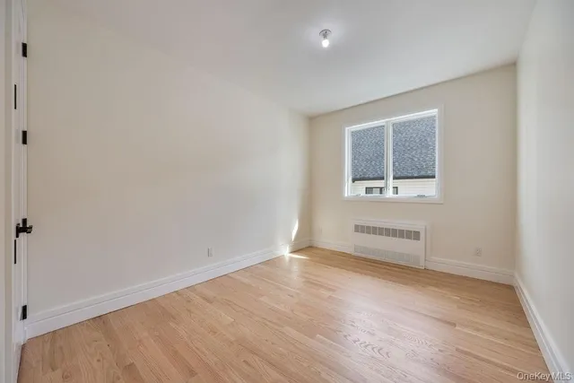 a white toilet sitting next to a bath tub