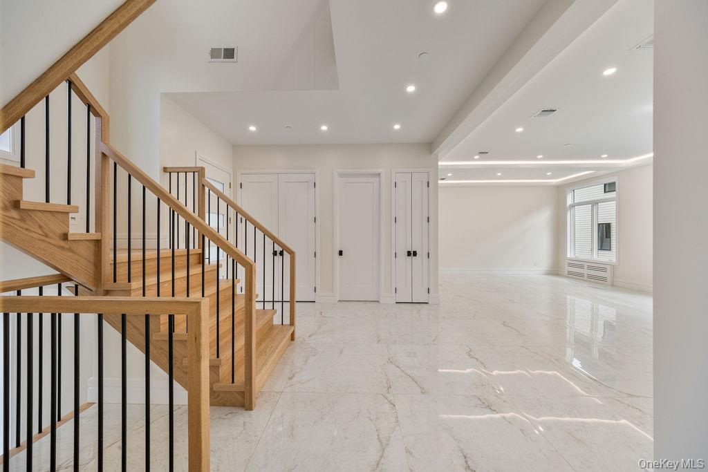 20 Singer Avenue, Unit 202 Spring Valley, NY 10977 - Photo 5 of 50 a view of a hallway with wooden floor and staircase