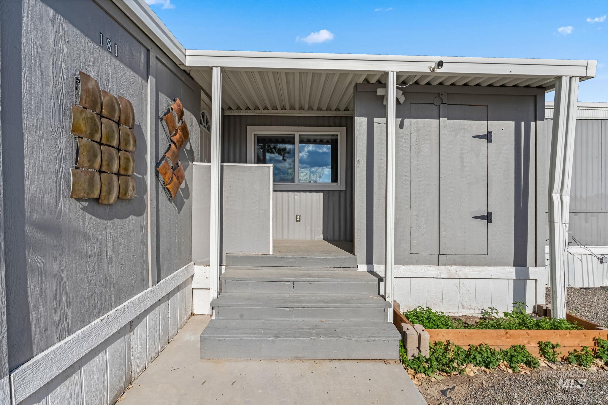 5015 East Ustick Road, Unit 181 Caldwell, ID 83605 - Photo 4 of 28 Entrance to property featuring covered porch