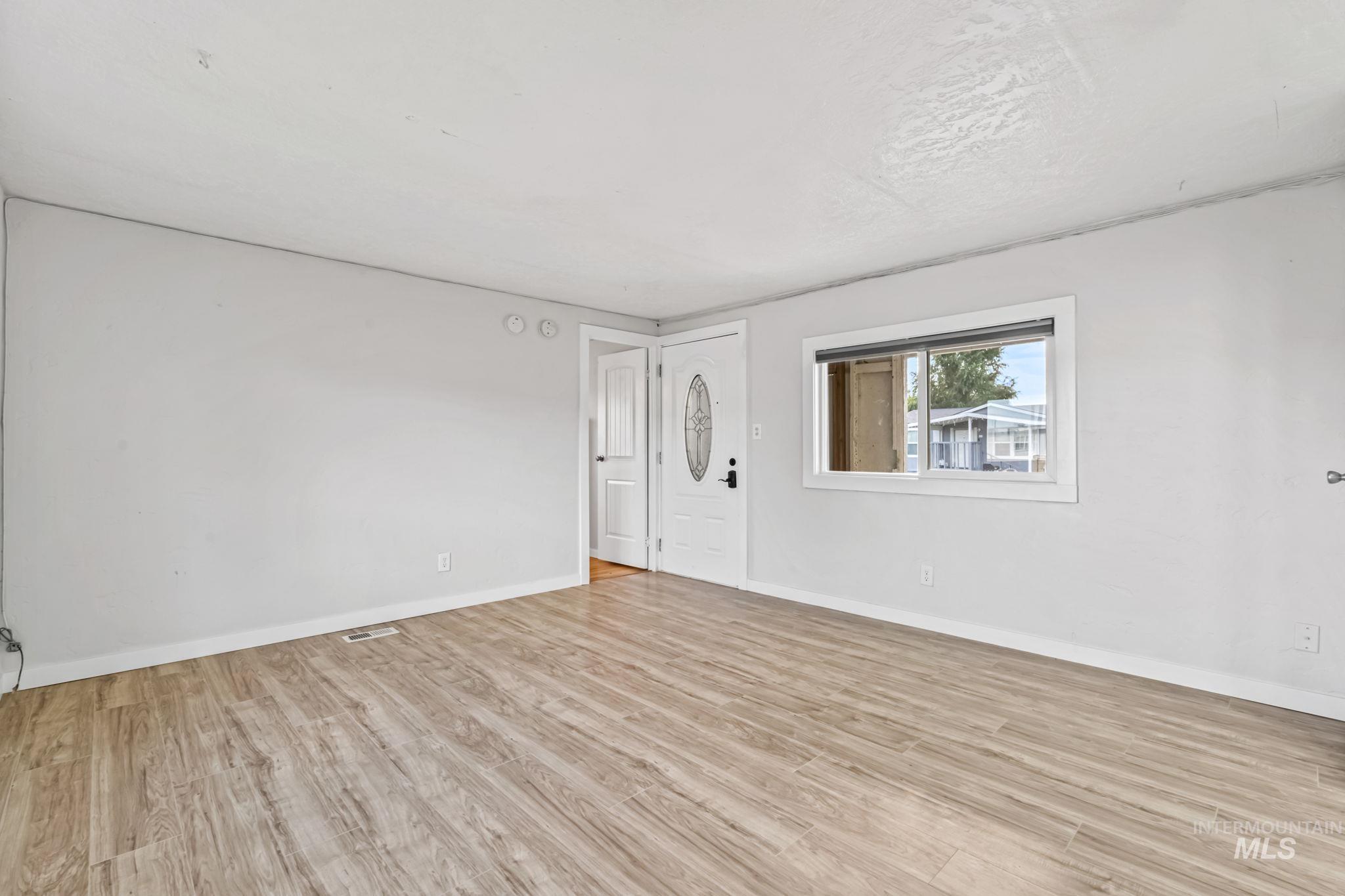 5015 East Ustick Road, Unit 181 Caldwell, ID 83605 - Photo 10 of 28 Unfurnished room with light wood-style flooring