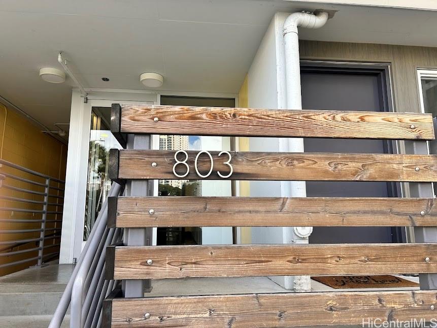 803 Waimanu Street, Unit 401 Honolulu, HI 96813 - Photo 1 of 18 a view of a building with a street sign
