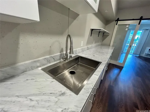 a kitchen with a sink stove and refrigerator
