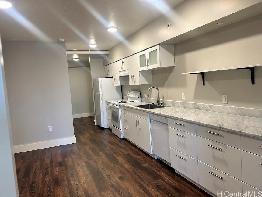803 Waimanu Street, Unit 401 Honolulu, HI 96813 - Photo 4 of 18 a kitchen with stainless steel appliances granite countertop a sink a stove and a refrigerator