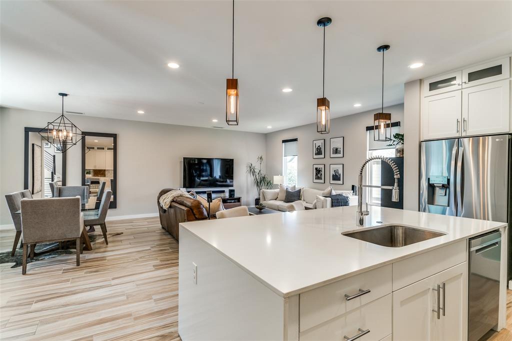 1925 California Drive, Unit 3 Dallas, TX 75204 - Photo 11 of 33 a kitchen that has a sink a counter space and stainless steel appliances
