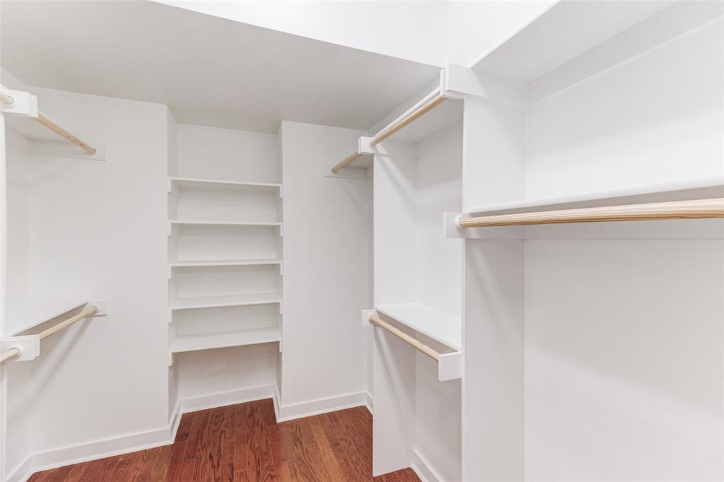 1925 California Drive, Unit 3 Dallas, TX 75204 - Photo 18 of 33 a view of walk in closet with empty racks