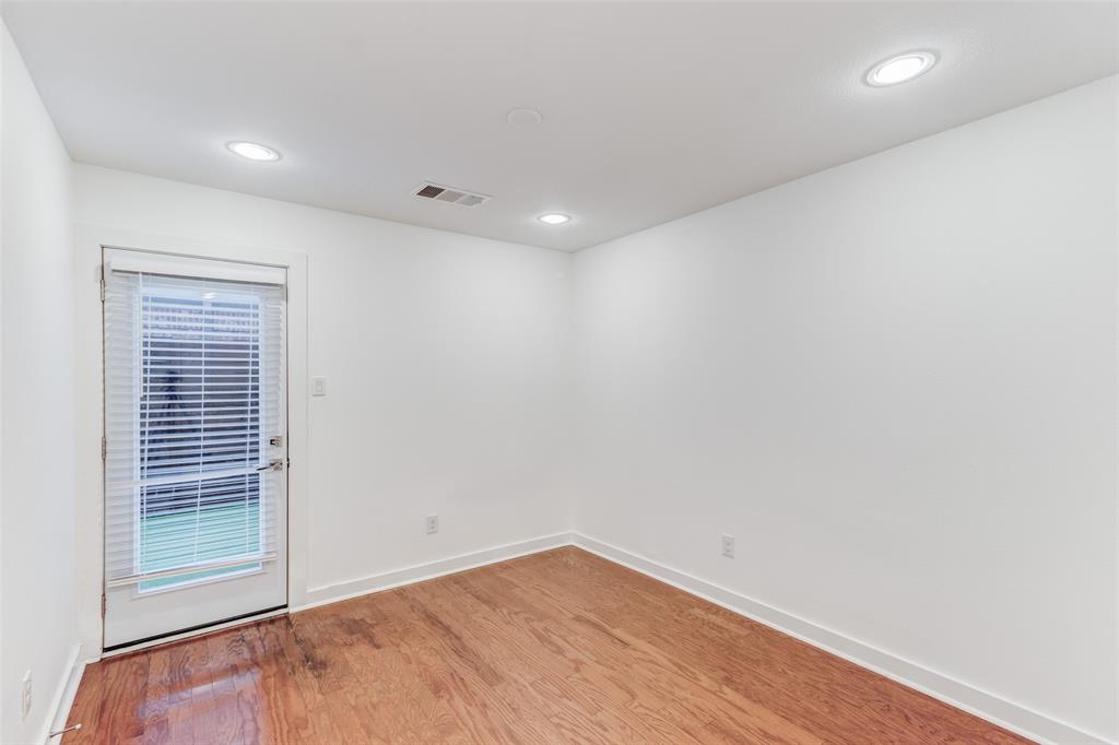 1925 California Drive, Unit 3 Dallas, TX 75204 - Photo 26 of 33 an empty room with wooden floor and windows