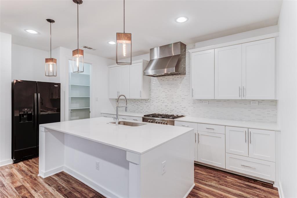 1925 California Drive, Unit 3 Dallas, TX 75204 - Photo 8 of 33 a kitchen with a sink a stove and refrigerator