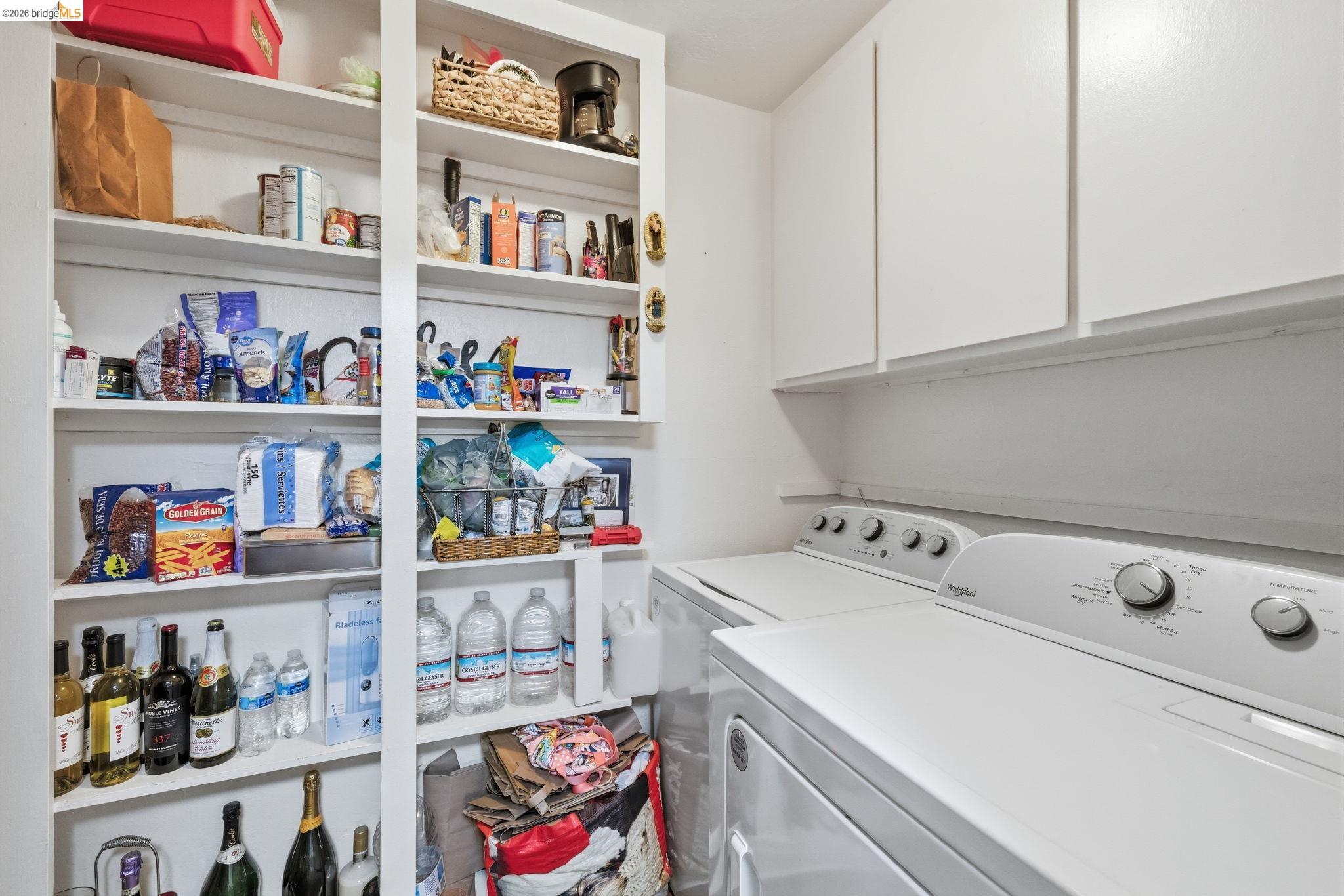 21999 Fallview Drive Sonora, CA 95370 - Photo 15 of 36 Laundry room featuring separate washer and dryer and cabinet space