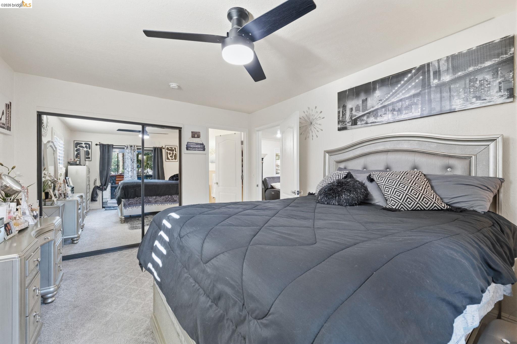 21999 Fallview Drive Sonora, CA 95370 - Photo 17 of 36 Bedroom featuring light colored carpet and a ceiling fan