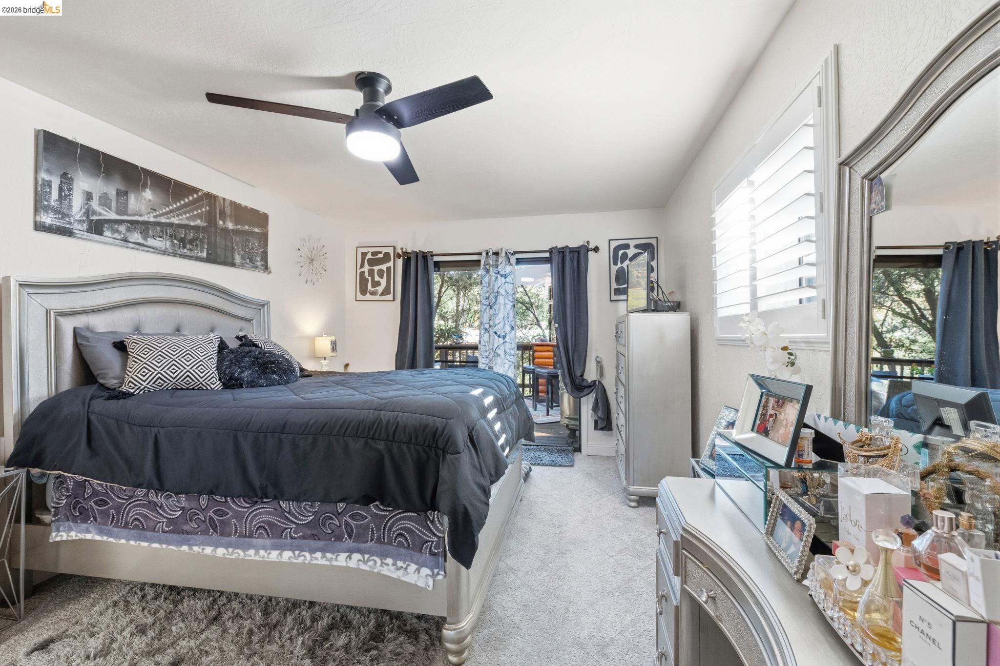 21999 Fallview Drive Sonora, CA 95370 - Photo 18 of 36 Bedroom with light carpet, a ceiling fan, and access to outside