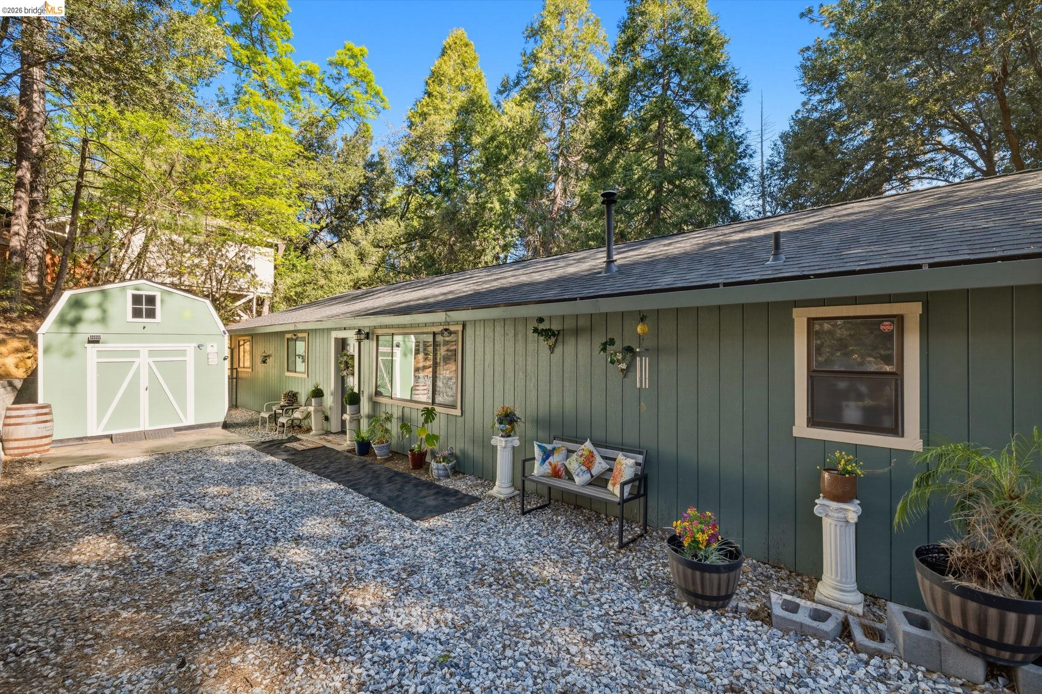 21999 Fallview Drive Sonora, CA 95370 - Photo 2 of 36 View of front of property with a shingled roof and a storage unit