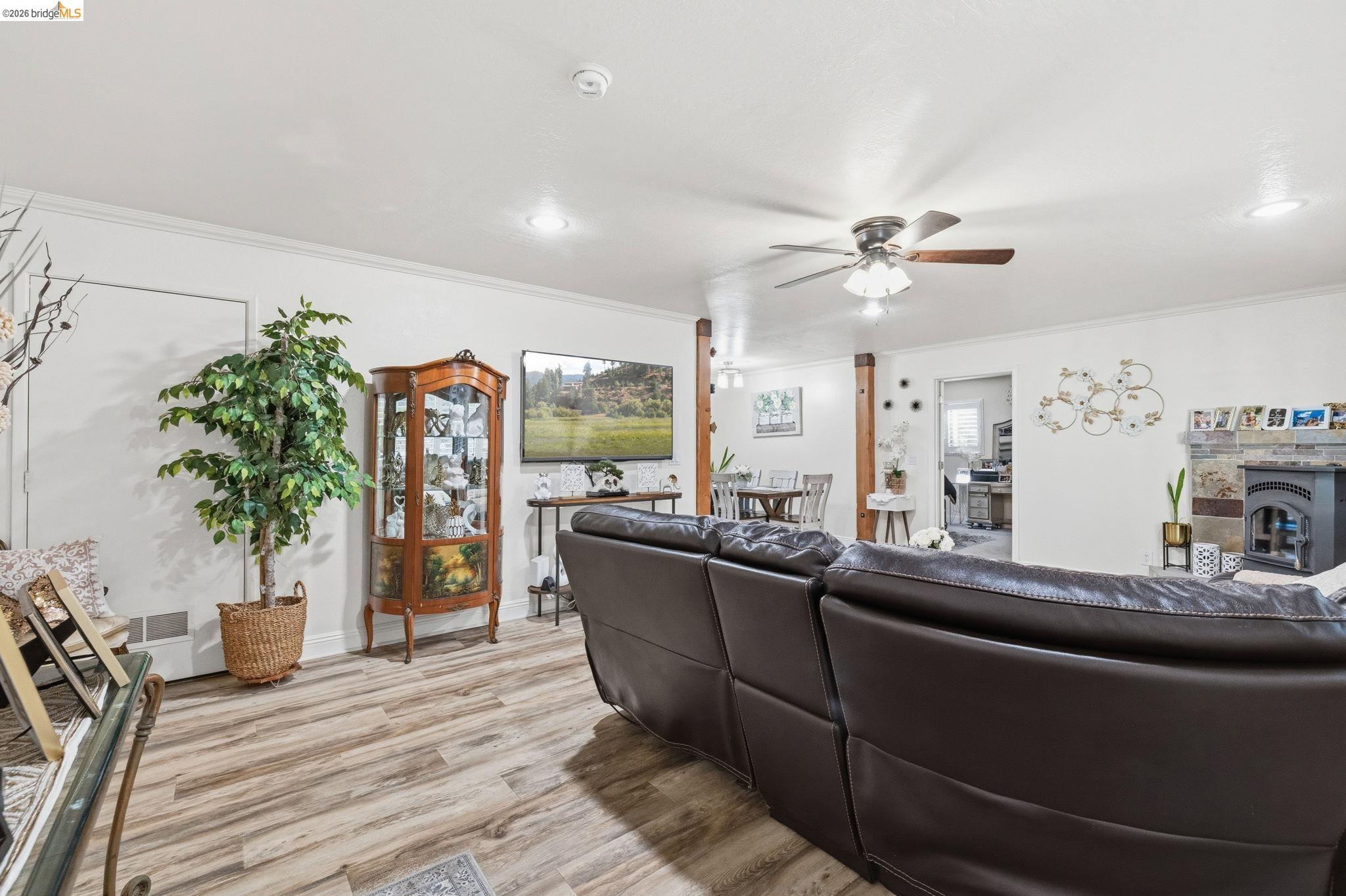 21999 Fallview Drive Sonora, CA 95370 - Photo 9 of 36 Living room featuring a ceiling fan, light wood-type flooring, ornamental molding, and recessed lighting