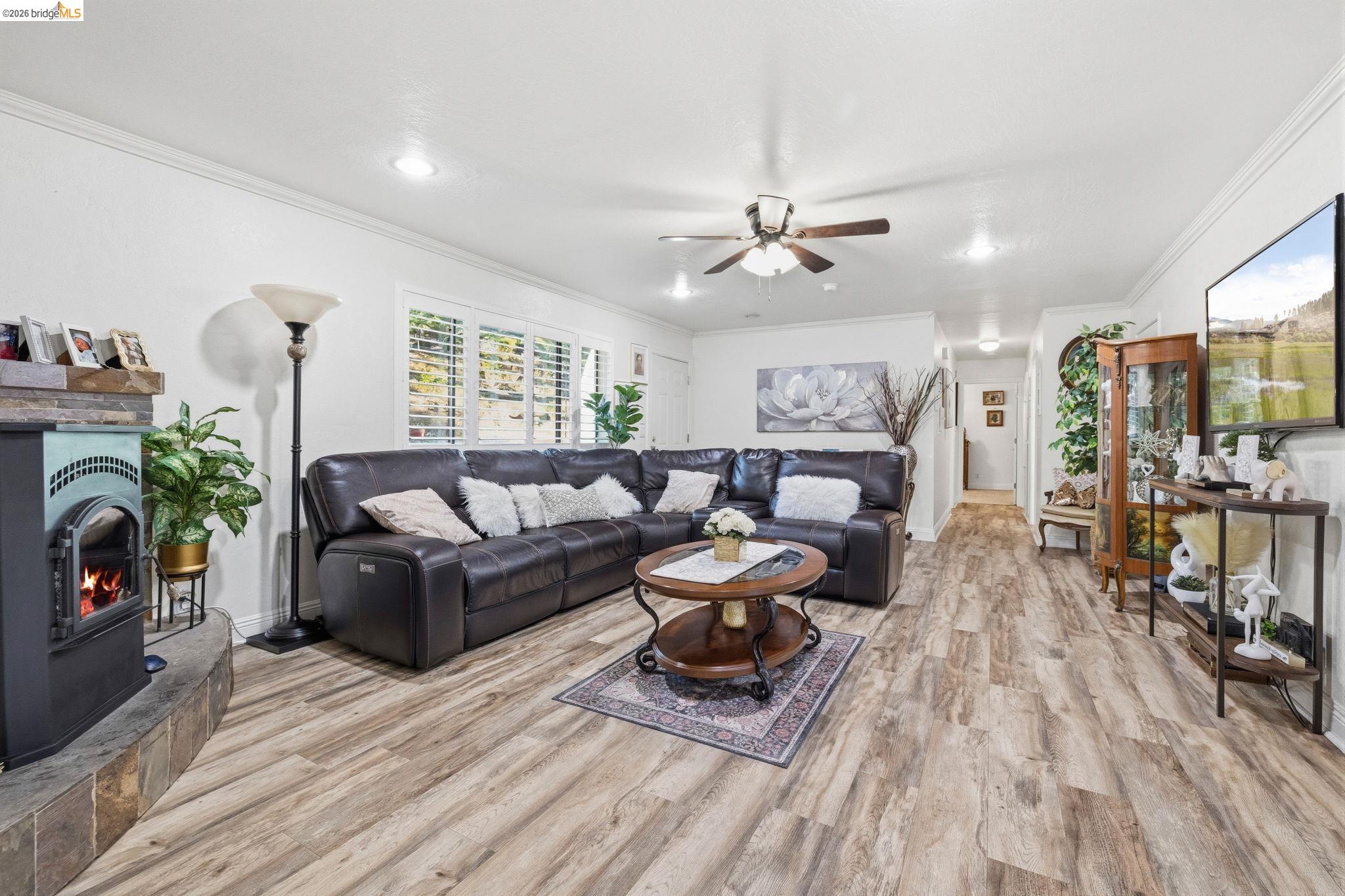 21999 Fallview Drive Sonora, CA 95370 - Photo 10 of 36 Living room featuring light wood-style floors, a ceiling fan, crown molding, and recessed lighting