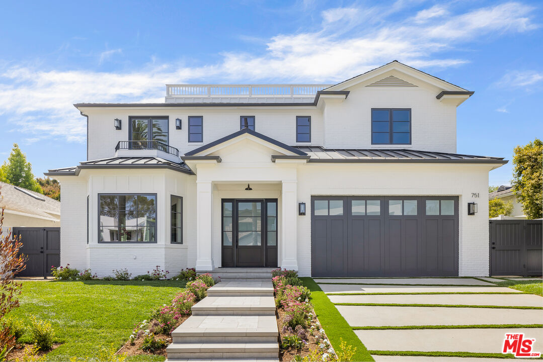 751 North Swarthmore Avenue Pacific Palisades, CA 90272 - Photo 1 of 60 a front view of a house with a yard