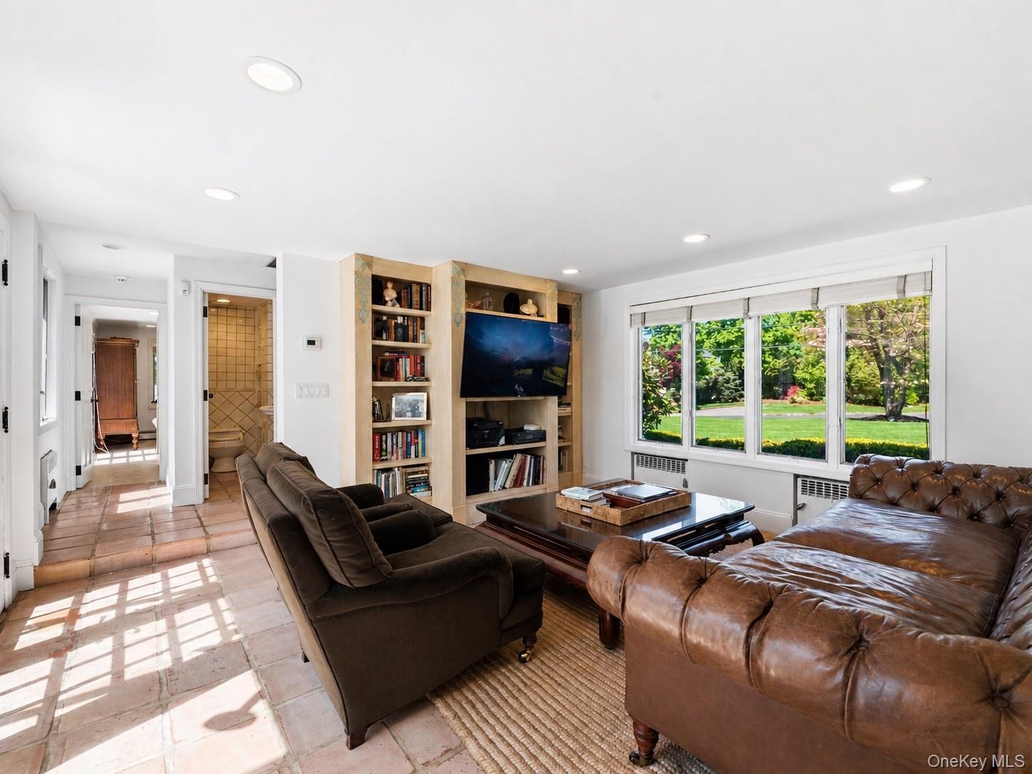 2 Aspen Place Great Neck, NY 11021 - Photo 15 of 48 Sun-Filled Family Room with Open Flow to Kitchen