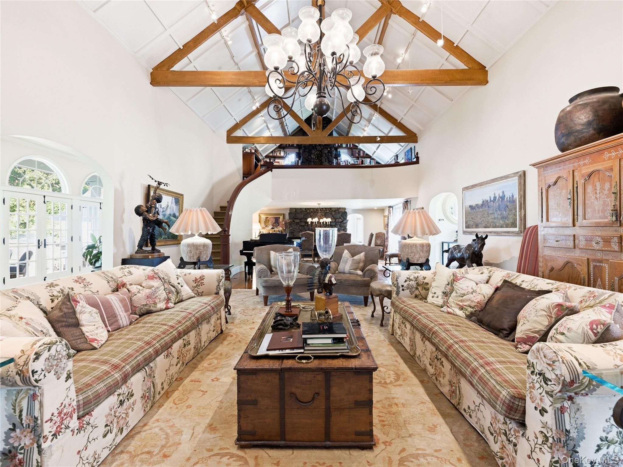 2 Aspen Place Great Neck, NY 11021 - Photo 7 of 48 Formal Living Room with Fireplace, Soaring Double-Height Ceilings, and Architectural Beams