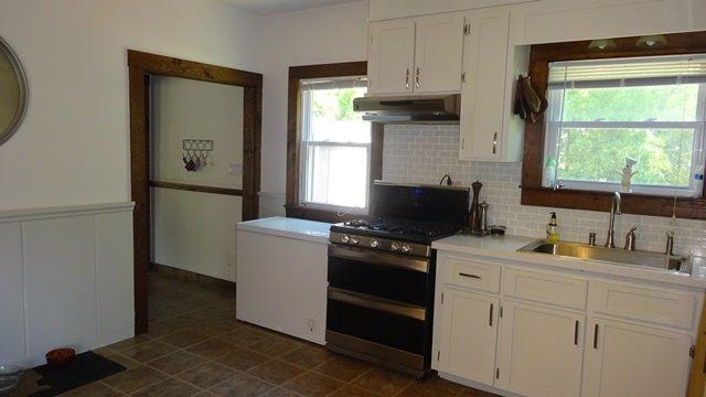 21 Cahoon Road Buzzards Bay, MA 02532 - Photo 7 of 34 a kitchen with stainless steel appliances a stove a sink and a window