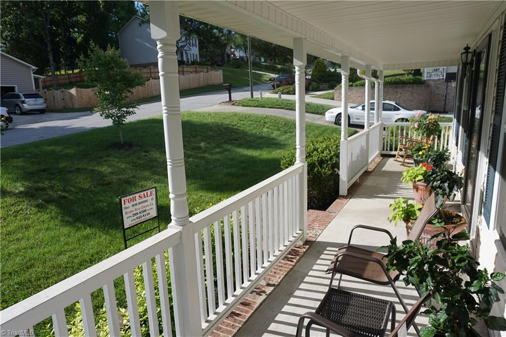 331 Ridgeland Drive High Point, NC 27262 - Photo 4 of 17 Sunny, beautiful front porch view enjoying the afternoon sun.