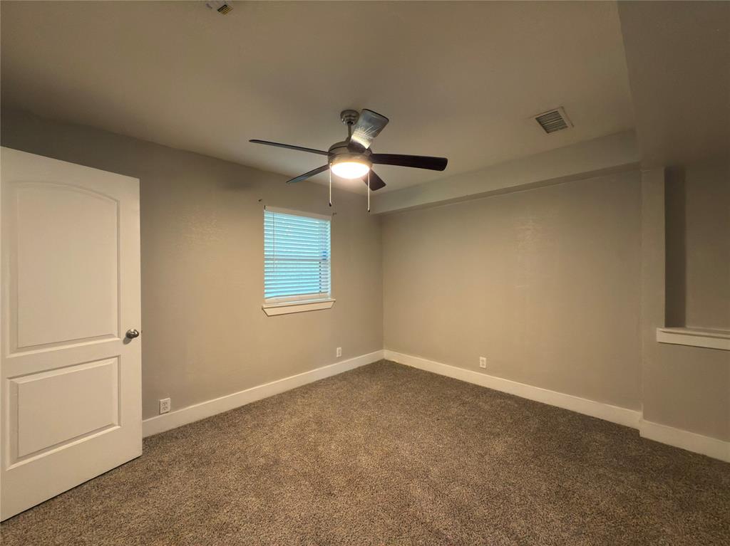 5928 Fletcher Avenue, Unit 16 Fort Worth, TX 76107 - Photo 11 of 20 a view of a livingroom with a ceiling fan and window