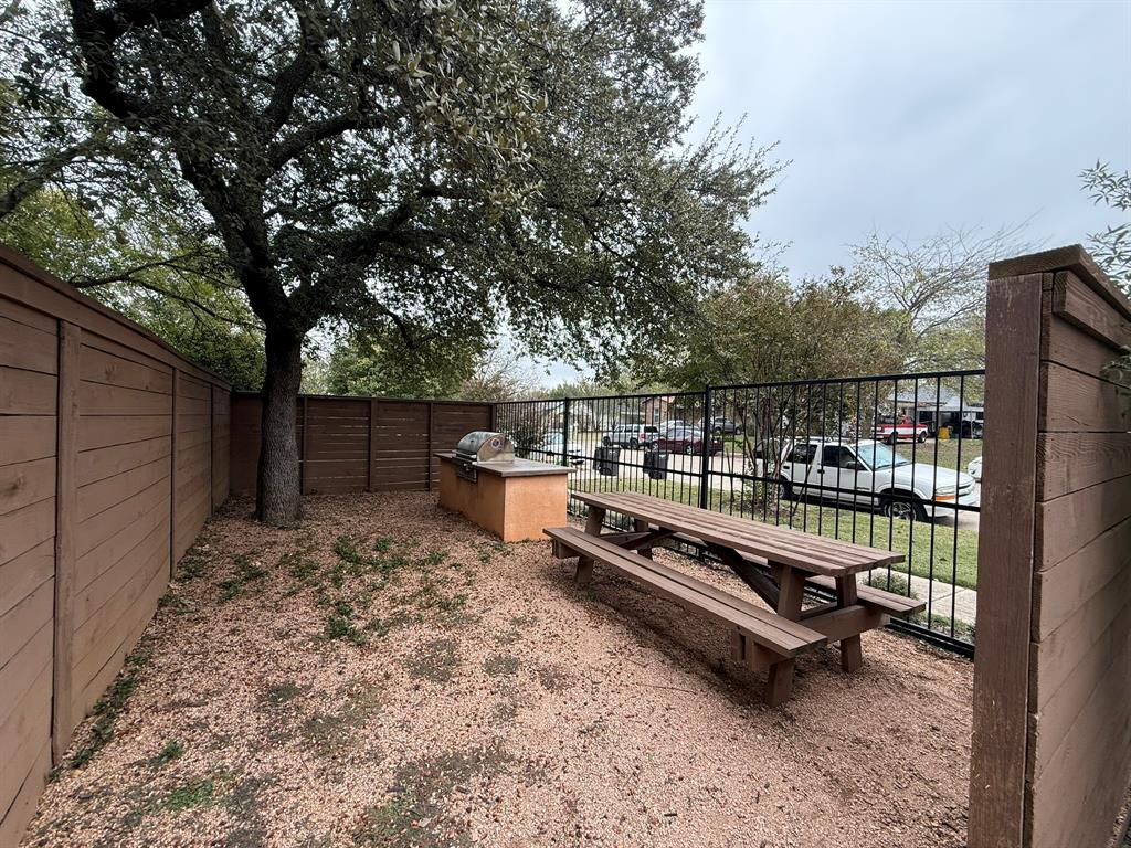 5928 Fletcher Avenue, Unit 16 Fort Worth, TX 76107 - Photo 17 of 20 a view of outdoor space with seating area