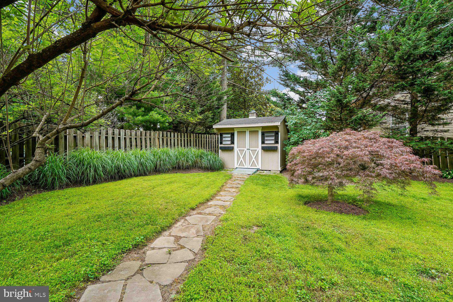 16 Maple Avenue Washington Grove, MD 20880 - Photo 10 of 58 Charming garden path leading to a shed.
